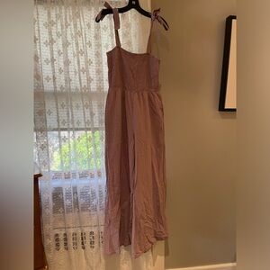 Mauve color smocked jumpsuit with shoulder ties. Sz. L